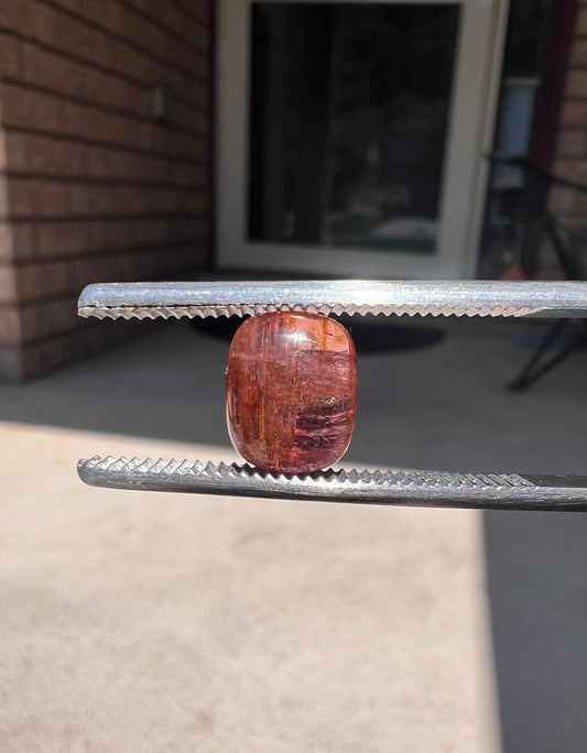 Pink/orange tourmaline cabochon