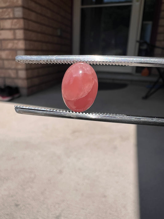 Oval rhodochrosite cabochon (A)