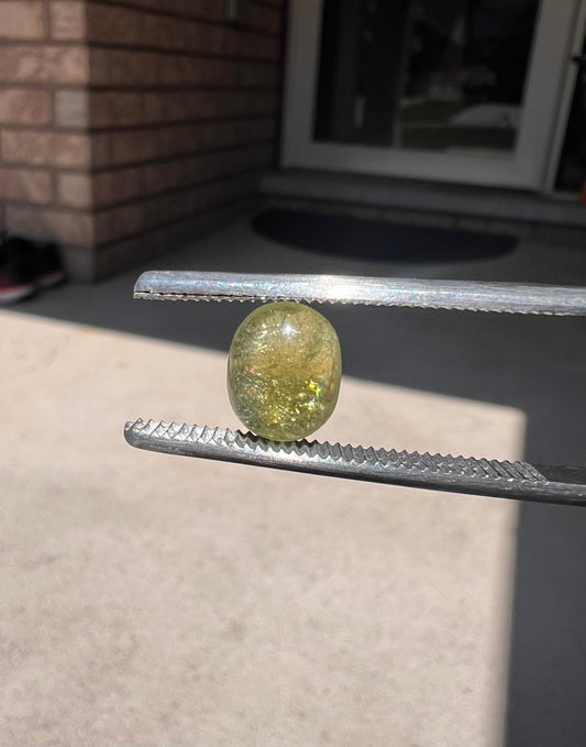 Yellow/green oval tourmaline cabochon